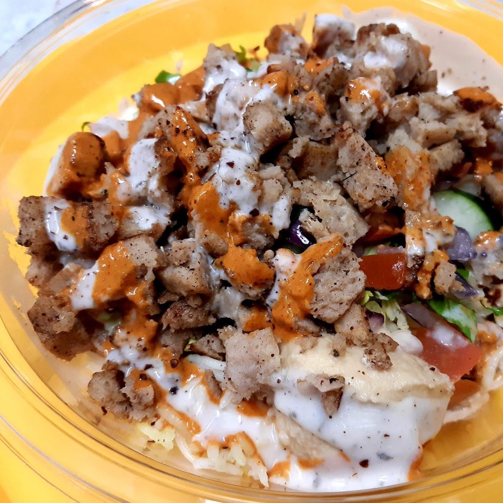 Lamb shawarma bowl with garlic and spicy sauce